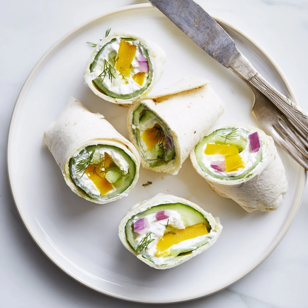 Crispy pickle-in-a-blanket rolls with creamy cheese, perfect for snacking or parties.  