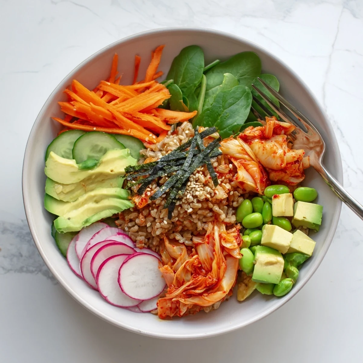 A colorful fermented vegetable bowl loaded with kimchi and fresh greens.  