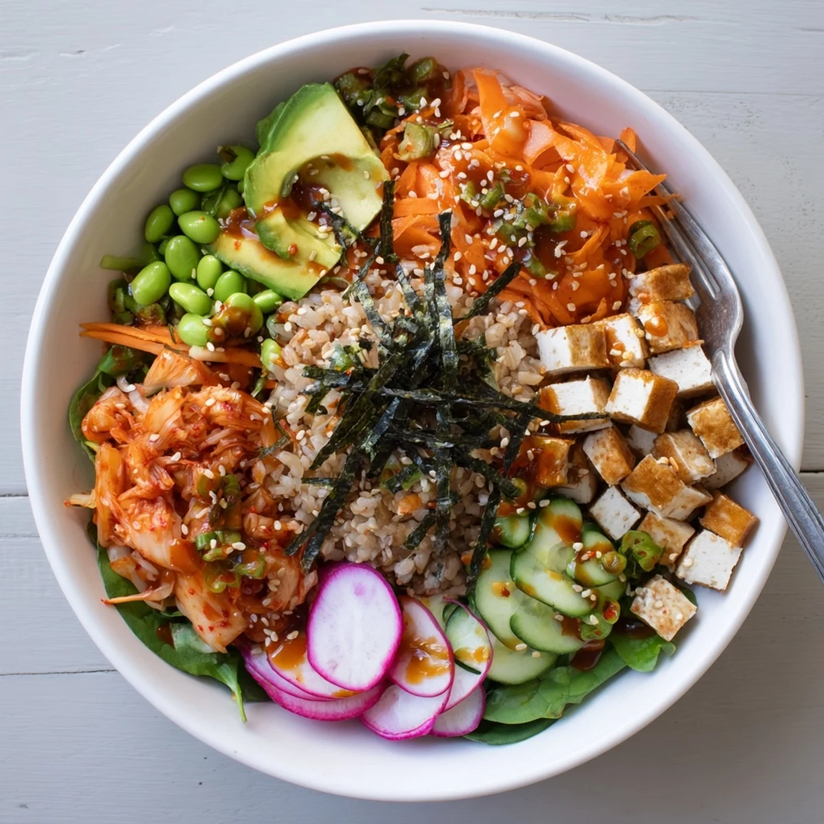 Healthy fermented vegetable bowl featuring grains, served with crunchy fresh veggies.
