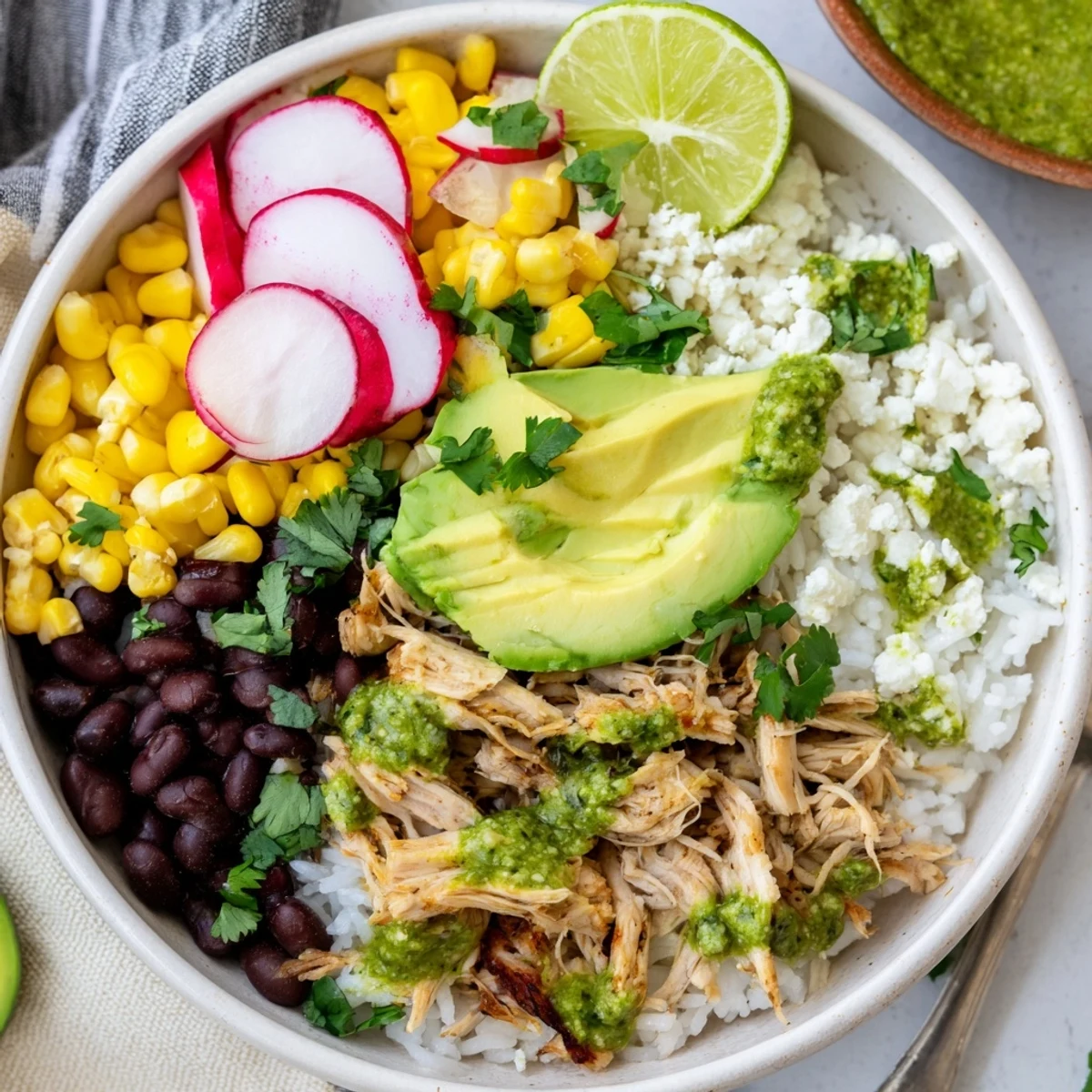 Bowl of Green Enchiladas Rice topped with fresh avocado and vibrant cilantro.  