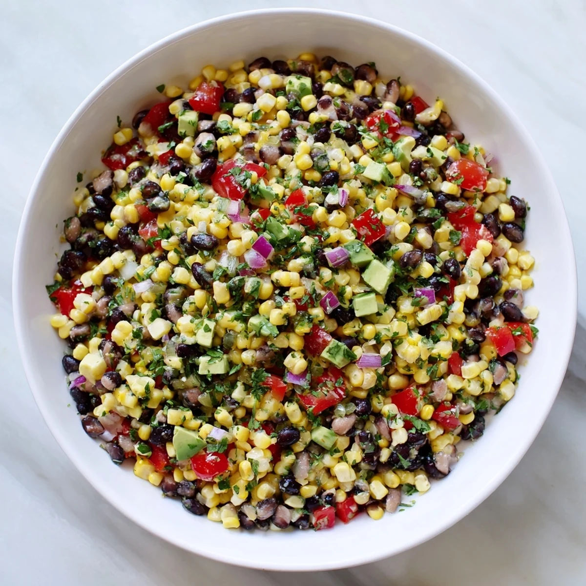 Fresh Southwestern Black Bean and Corn Salad, a colorful mix ready to eat with a vibrant lime dressing.