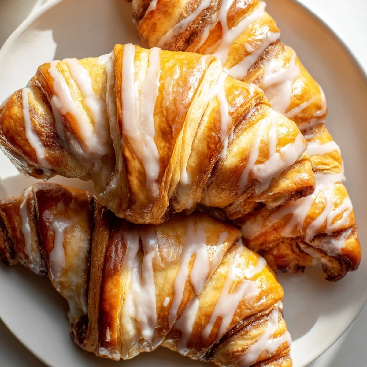 Air-Fryer Cinnamon Roll Twists: Golden, glazed and swirled, ready for breakfast—perfectly air-fried cinnamon-sugar pastries.