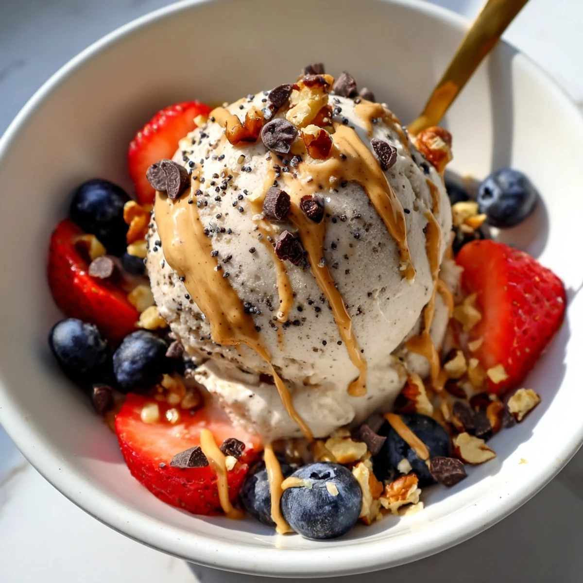 Homemade Protein Ice Cream Bowl, a chilled and delightful treat with swirls of peanut butter.