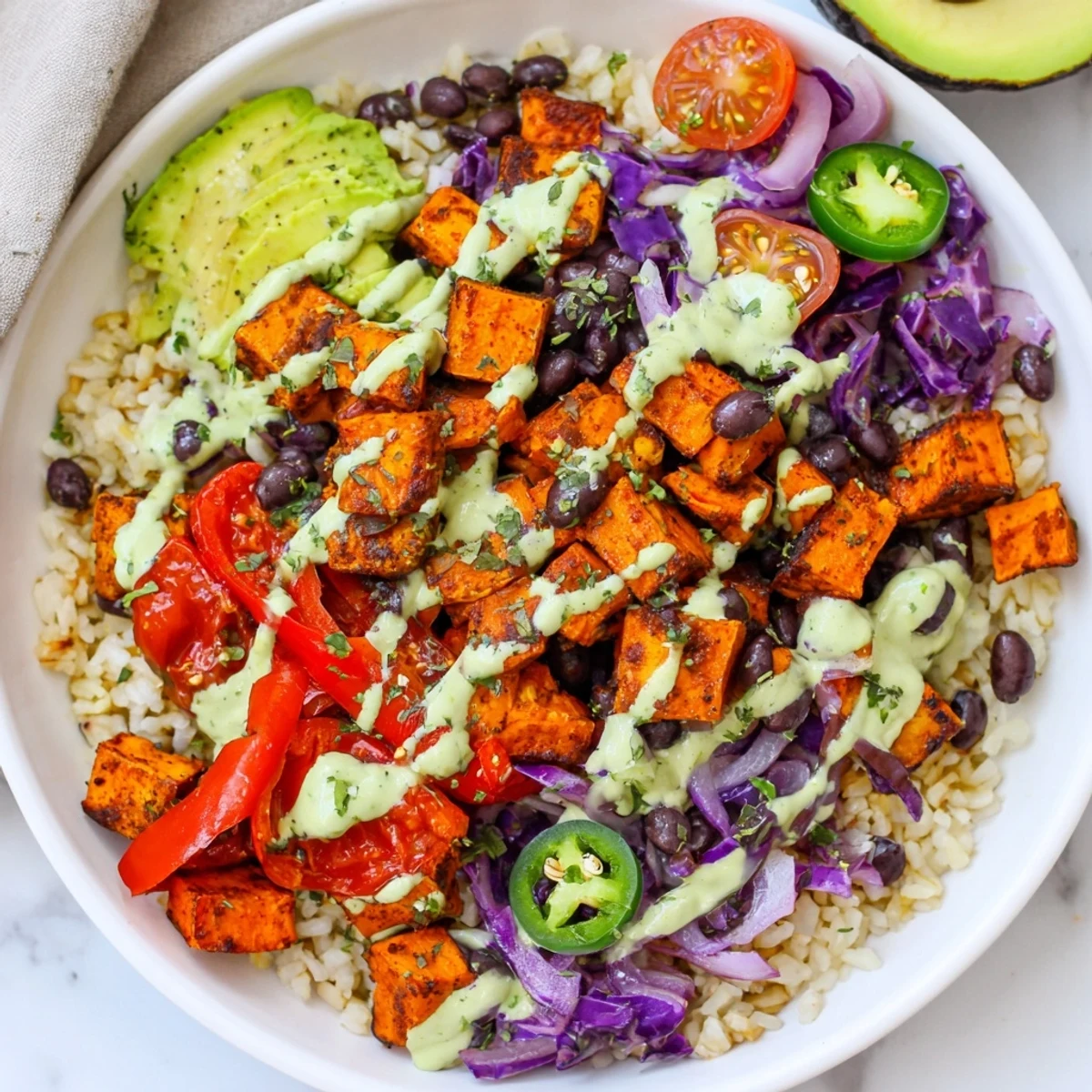 Flavorful Sweet Potato Taco Bowls with colorful roasted vegetables and creamy avocado, perfect for dinner.