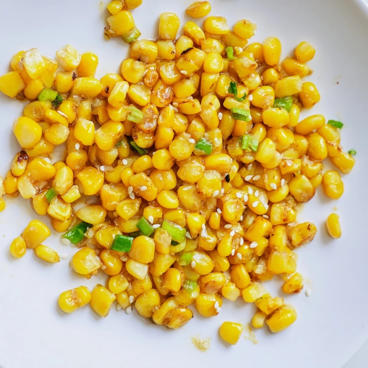 Golden, glistening Japanese Butter Corn with scallions, a delightful side dish ready to be served.