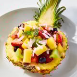Brightly colored Tropical Bliss Pineapple Fruit Boat, a delicious and easy vegan dessert, ready to serve and enjoy.