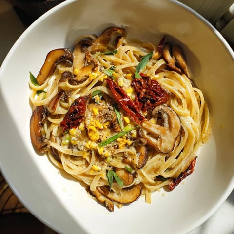 Vegan Marry Me Mushroom Pasta, a creamy Italian dish served with fresh basil and vegan Parmesan.