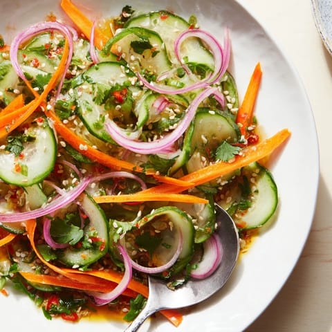 Bright and zesty cucumber salad remix topped with toasted sesame seeds for added crunch.  
