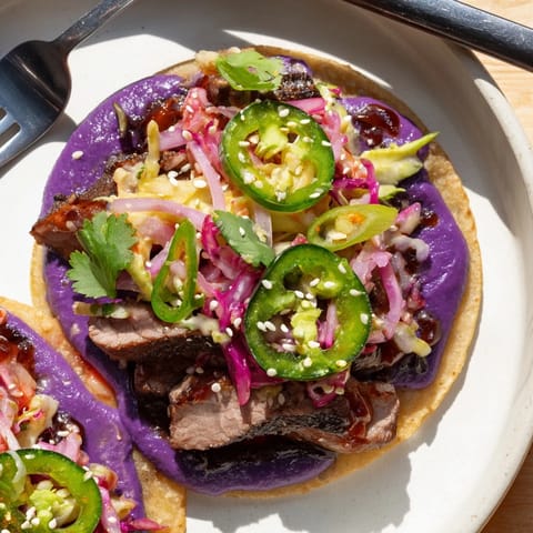 Savory Korean bulgogi meat nestled in warm tortillas with fresh, zesty toppings.  