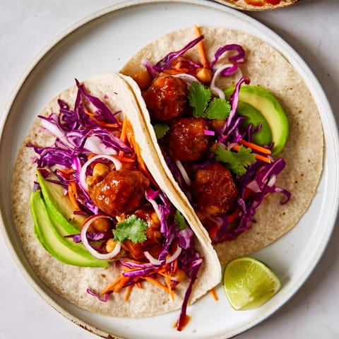 Freshly assembled BBQ Chickpea & Slaw wrap, filled with vibrant ingredients, ready to eat.