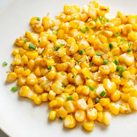 Close-up of savory Japanese Butter Corn, highlighting tender kernels and aromatic garlic butter sauce.