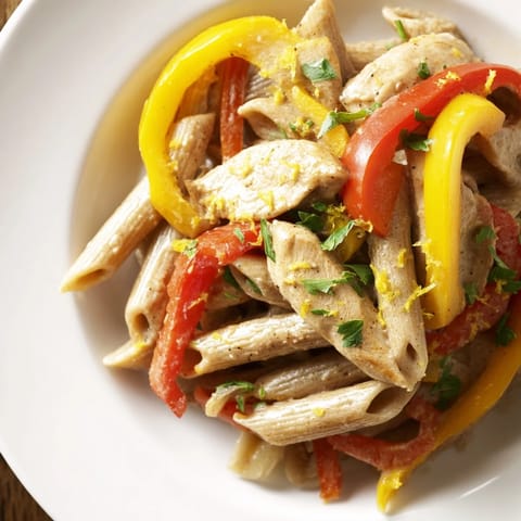 A lighter take on a classic, this Creamy Cajun Chicken Pasta Lite showcases tender chicken and colorful peppers in a rich, reduced-fat sauce.  