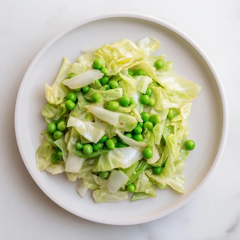 Close-up of a colorful cabbage stir-fry with garlic and soy sauce, ready to serve hot.