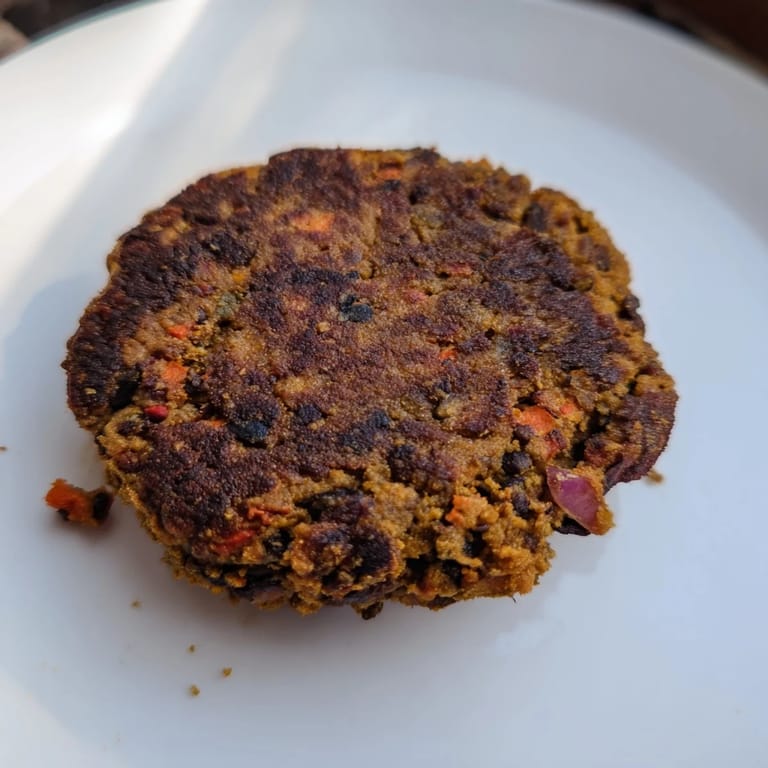 Chewy and flavorful, these perfectly cooked black bean burgers are a satisfying vegetarian dinner option.